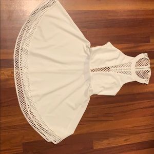 white mini open back dress